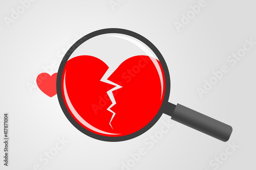 Magnifying glass above with cracked heart symbol inside it