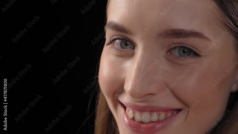 Perfect skin beautiful model with long beautiful long hair turn face on camera. Pretty girl with clean fresh skin. Part of face, young woman close up. Beauty and skin care. Cosmetology. 4K footage. Perfect skin beautiful model with long beautiful long hair turn face on camera. Pretty girl with clean fresh skin. Part of face, young woman close up. Beauty and skin care. Cosmetology. 4K footage.
