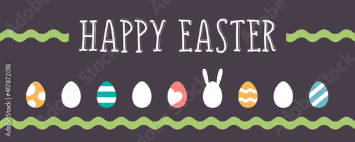 Banner With Easter, a rabbit hiding among the painted eggs.