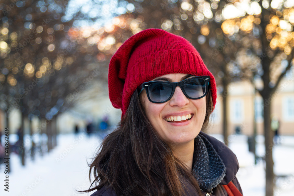 smilling woman in winter, woman with a red hat in winter, woman with sunglasses smilling woman in winter, woman with a red hat in winter, woman with sunglasses