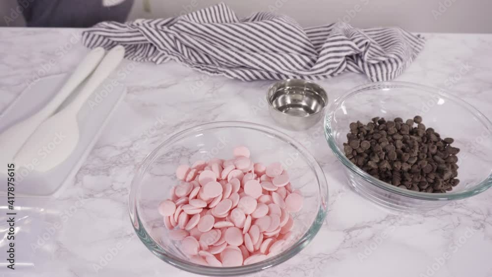 Time lapse. Step by step. Ingredients for melting chocolate chips in chocolate melting pots on kitchen counter. Time lapse. Step by step. Ingredients for melting chocolate chips in chocolate melting pots on kitchen counter.