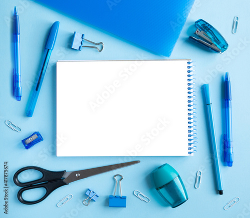 Blue stationery and notepad. Back to school concept. With space for text 