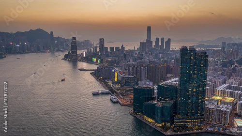 Aerial view sunset at Victoria Harbor of Hong Kong  - Timelapse