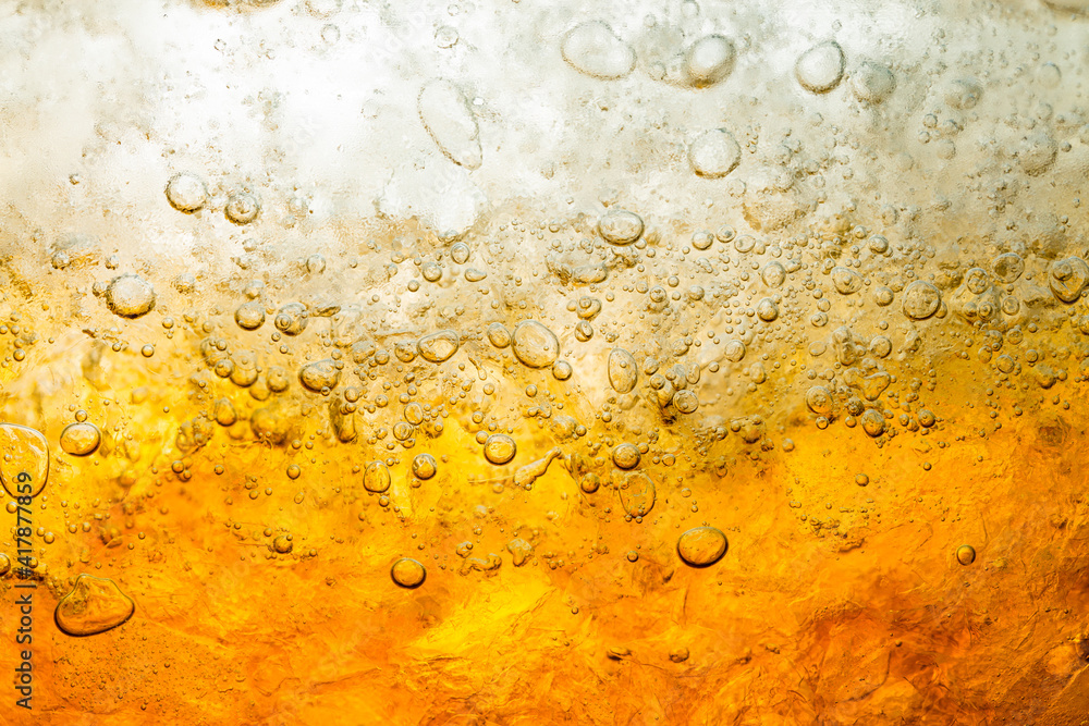 Soft drink glass with ice splash on dark background. Cola glass in celebration party concept.