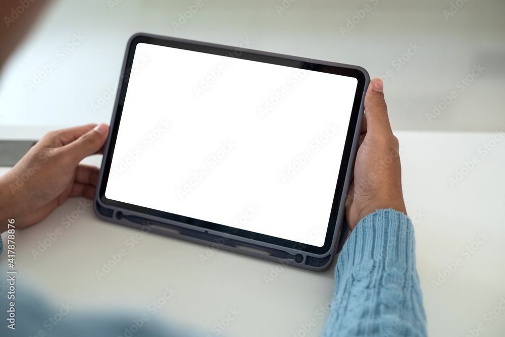 Mock up. Man holding tablet white blank screen at home. Mock up. Man holding tablet white blank screen at home.