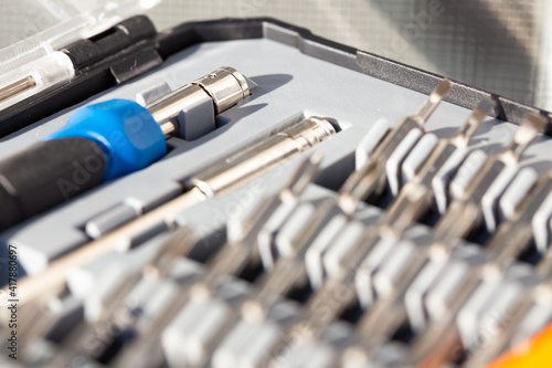 A set of precision tools and screwdrivers. Close-ups of details in natural light