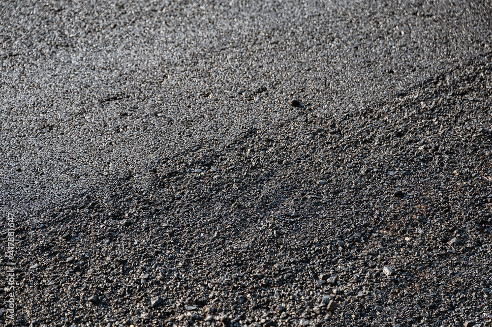 New asphalt tarmac texture road of repairing on the damaged highway New asphalt tarmac texture road of repairing on the damaged highway