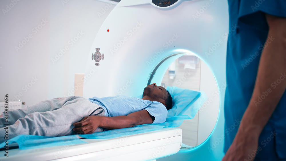 Black patient talking with doctor about CT scan Black patient talking with doctor about CT scan