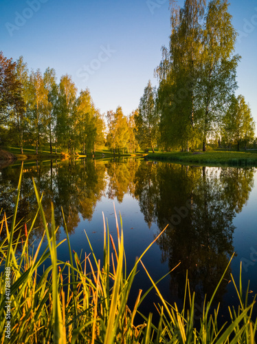 Fototapeta Naklejka Na Ścianę i Meble -  Beautiful Tree Reflection in Lake on Sunny Day - Autumn Colors