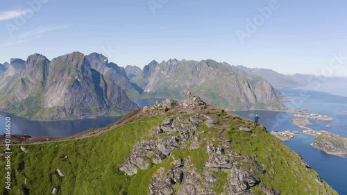 Flying around mount Reinebringen with tourists in the Lofoten Islands, Norway