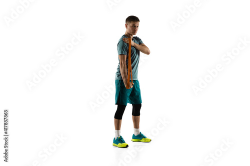 Fototapeta Naklejka Na Ścianę i Meble -  Healthy. Young caucasian male model in action, motion isolated on white background with copyspace. Concept of sport, movement, energy and dynamic, healthy lifestyle. Training, practicing. Authentic.