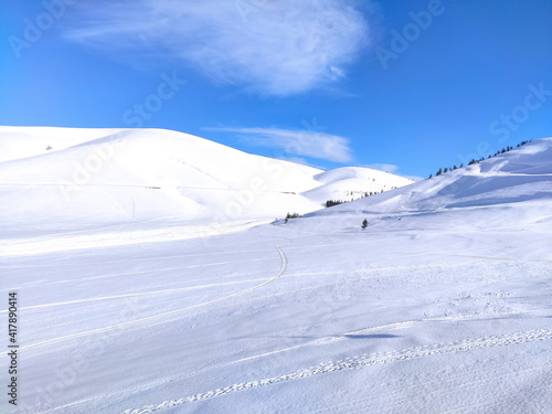snowy hills and blue sky