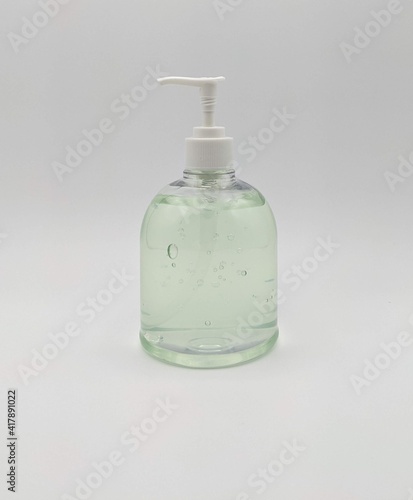 Green Hand Sanitizer in Clear Pump Bottle with Aloe Ready to Kill Flu Cold and Covid 19 Germs