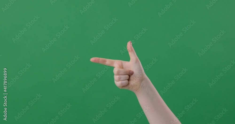Woman hand pointing left on green screen Woman hand pointing left on green screen