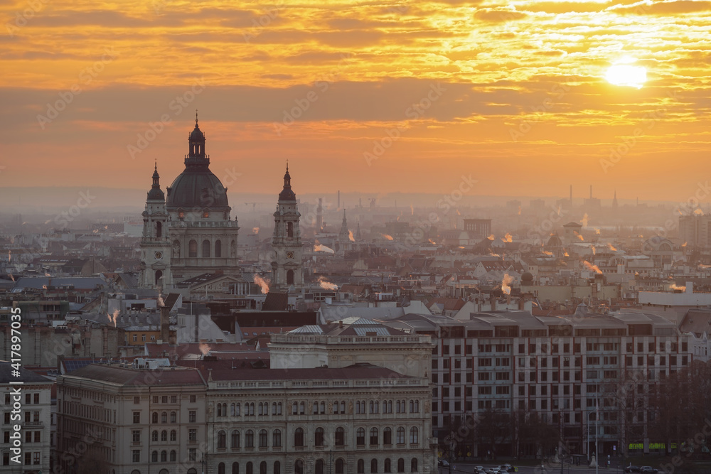 Budapest panoramic cityscape with St Stehen basilica towers and amazing sunrise lights in capital city of Hungary.