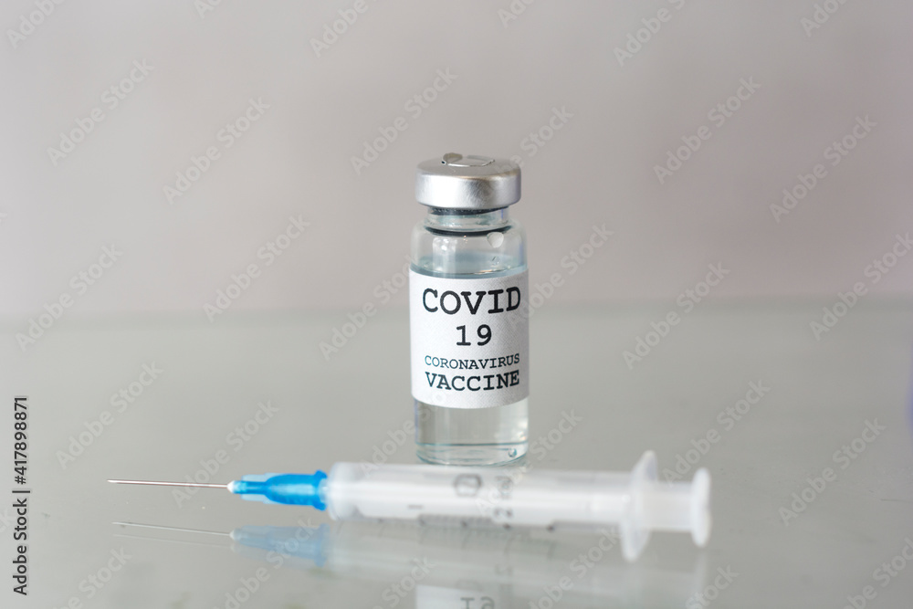 Vaccine and syringe injection. It use for prevention,immunization and treatment from corona virus infection(novel coronavirus disease 2019,COVID-19,nCoV 2019 from Wuhan). Medicine infectious concept. Vaccine and syringe injection. It use for prevention,immunization and treatment from corona virus infection(novel coronavirus disease 2019,COVID-19,nCoV 2019 from Wuhan). Medicine infectious concept.