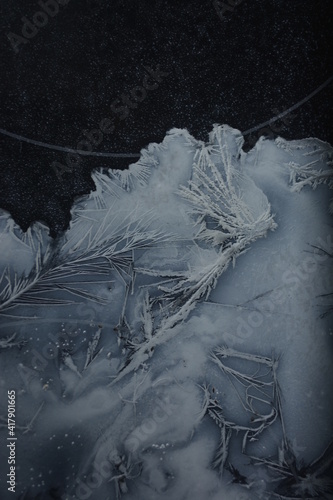 frosty patterns on dark glass
