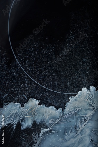 frosty patterns on dark glass