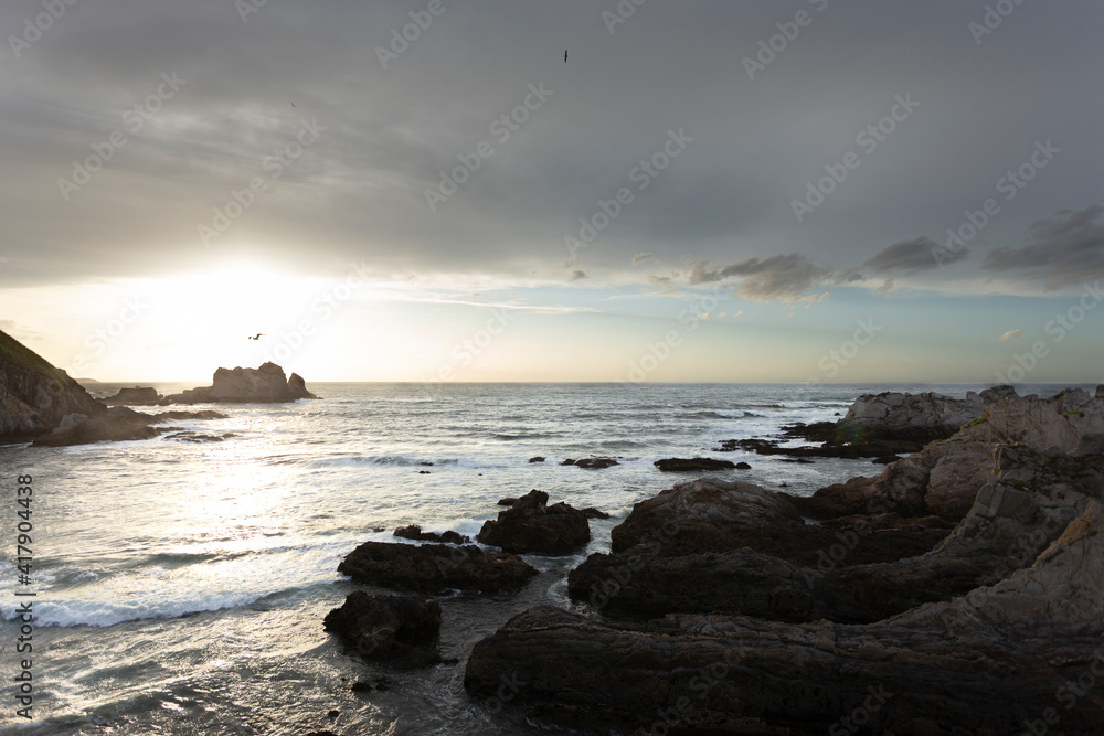 sunset over the sea and cliffs in Asturias