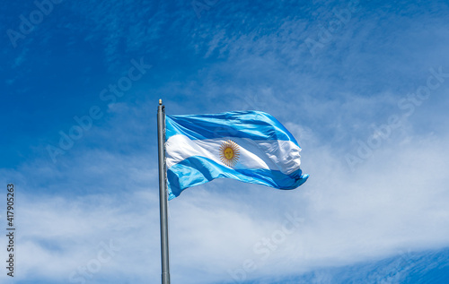 Argentina's flag and the sky of Buenos Aires photo