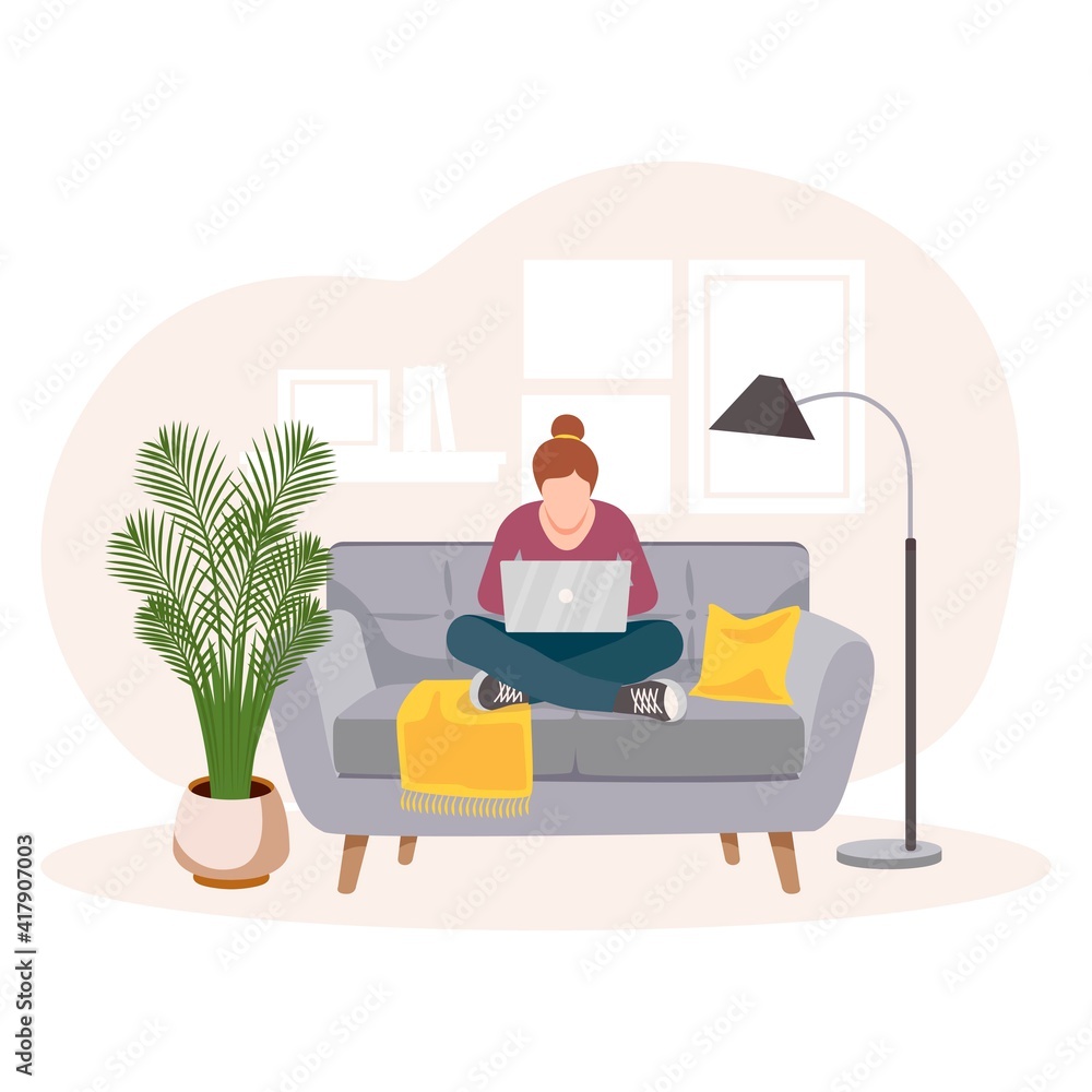 The concept of home office. Self-isolation during the coronavirus epidemic. A woman working from home, distance learning sitting on the couch, the concept of remote work. Freelancer. Interior of room.