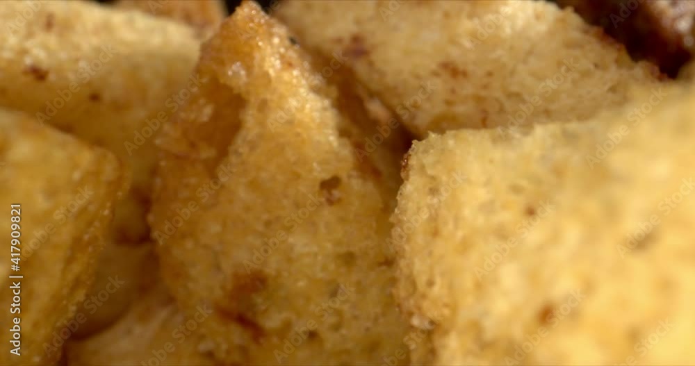 Garlic Croutons entire gluten-free and low carb. Crackers Food Crisps Snacks close-up on black background. Zoom out. High quality. Garlic Croutons entire gluten-free and low carb. Crackers Food Crisps Snacks close-up on black background. Zoom out. High quality.