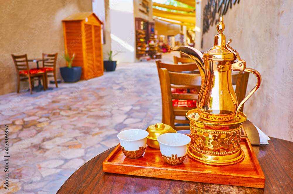Enjoy Arabic Coffee From Dallah Coffee Pot In Traditional Coffee House enjoy-arabic-coffee-from-dallah-coffee-pot-in-traditional-coffee-house
