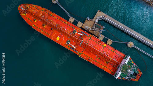 Aerial view industrial crude oil and fuel tanker ship at deep ocean sea port, Tanker ship vessel at terminal port, Business import export oil and gas petrochemical by tanker ship transportation oil. © Kalyakan