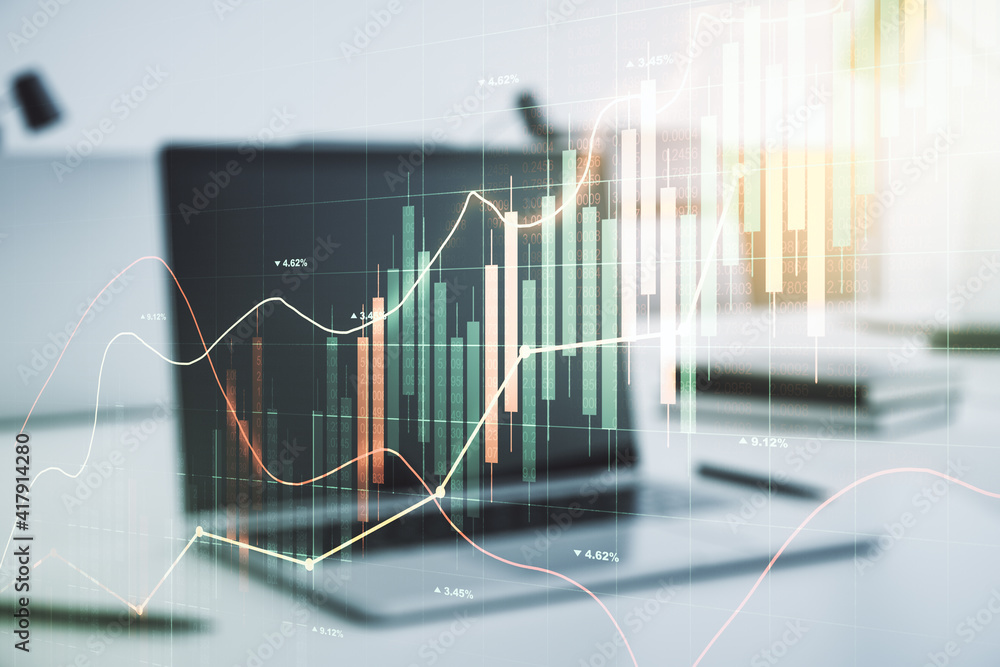Abstract creative financial graph on modern laptop background, financial and trading concept. Multiexposure Abstract creative financial graph on modern laptop background, financial and trading concept. Multiexposure