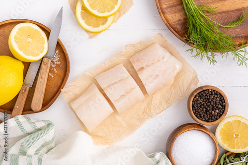 Freshly caught halibut cut into pieces for cooking. Healthy seafood recipe.