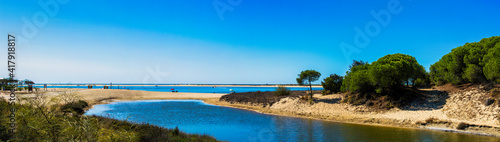 Panoramic of El Portil beach with sky clouds