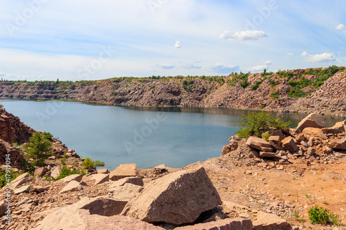 View of the lake at abandoned quarry on summer