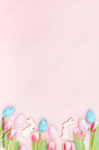 Photography Flat lay easter composition with pink tulips and eggs on pink background
