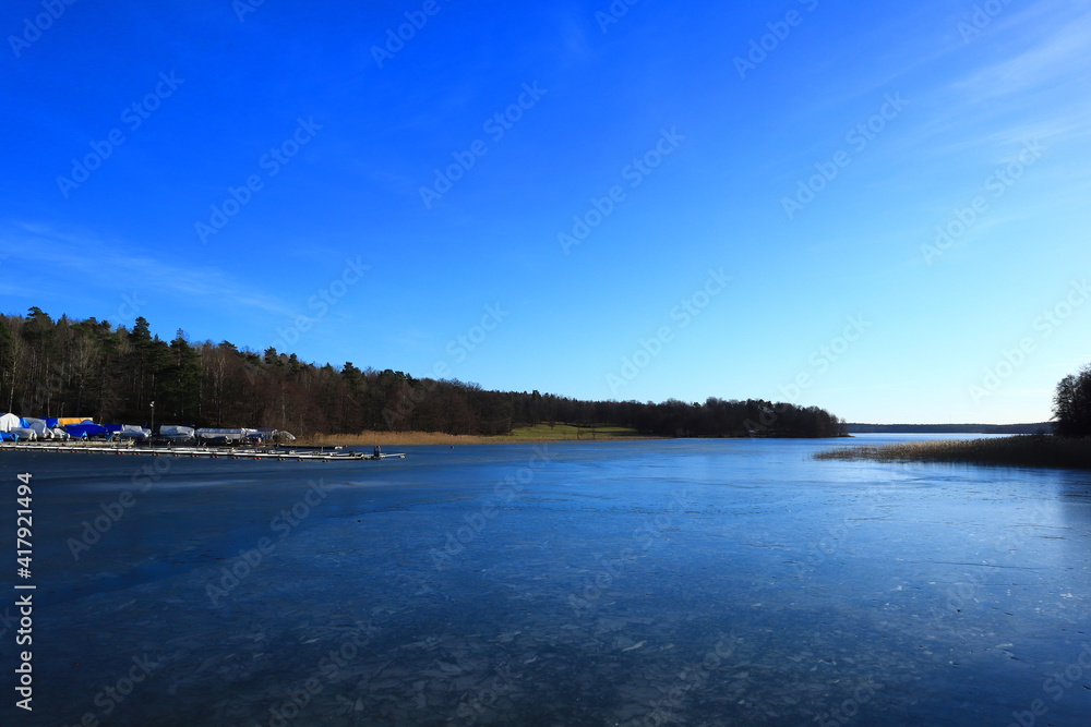 View over the lake Malar och Malaren(Mälaren in Swedish). During the winter or early spring. This ice on the water. Nice landscape and nature. Stockholm, Sweden, Europe.