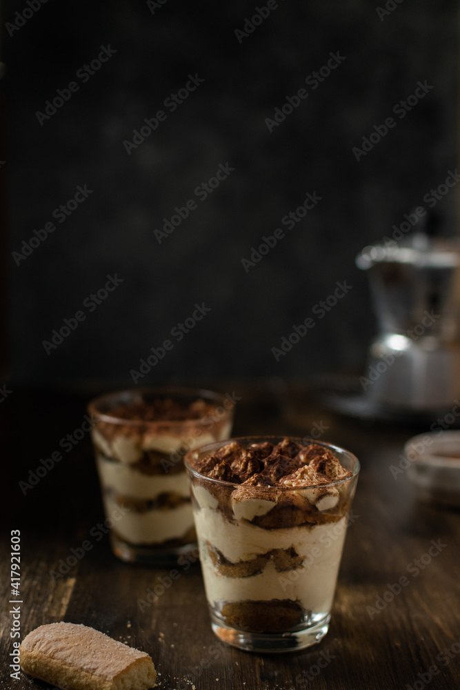 Traditional italian homemade tiramisu with mascarpone and cocoa powder Traditional italian homemade tiramisu with mascarpone and cocoa powder
