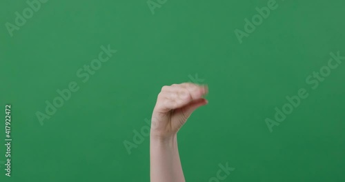 Female hand showing talking hand open shut mouth isolated in green screen