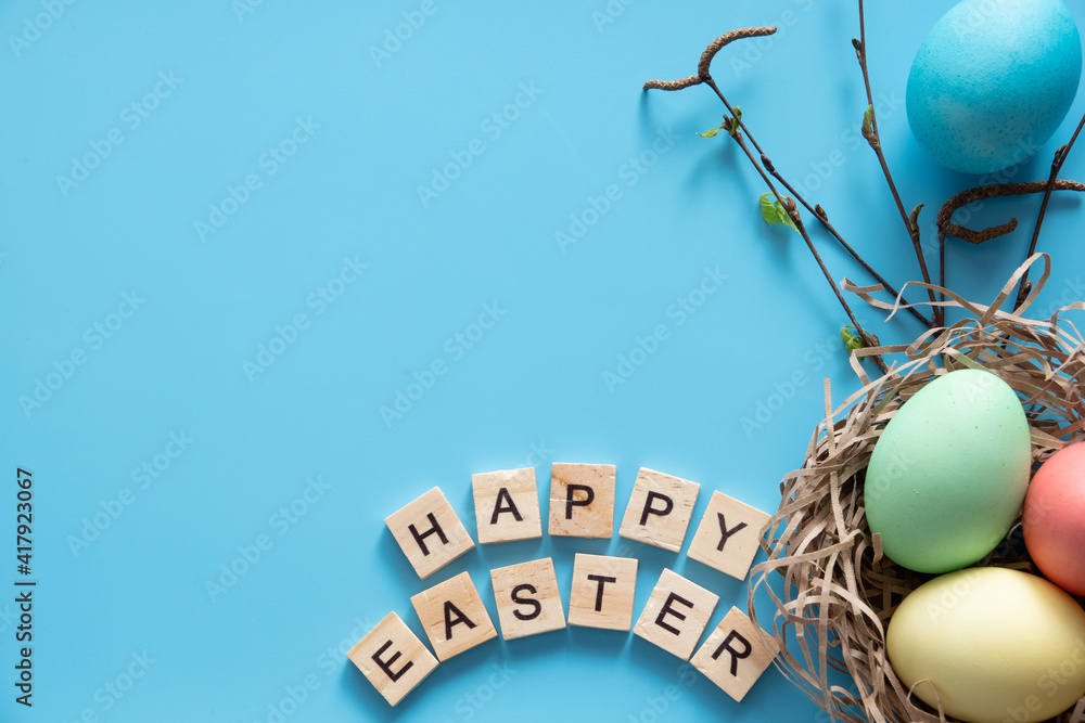 Easter eggs painted in pastel colors on blue background. Easter concept Easter eggs painted in pastel colors on blue background. Easter concept