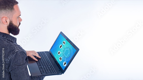 A bearded man remotely cont...