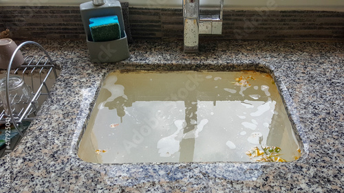 Tableau sur toile Overflowing kitchen sink, clogged drain. Plumbing problems.