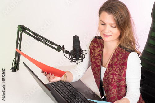 A girl records a podcast. A...