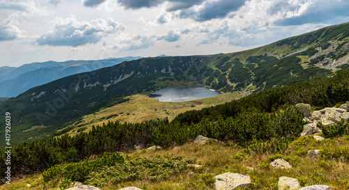 Zanoaga mountain lake in Retezat mountains in Romania photo