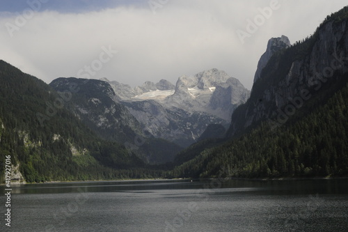 Gosauseen montain in Austria whit snow on top and a lake below