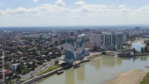 Krasnodar, Russia. New residential buildings on the Kubanskaya embankment. The Kuban River. Flight over the city in summer, Aerial View, Point of interest photo