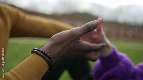 Young interracial couple holding palms and hands together. tolerance union concept