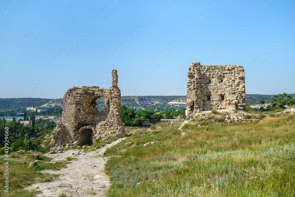 Remains of towers of Kalamita fortress, Inkerman, Crimea. It was founded in VI AD by Byzantines nearby cave monastery. City Inkerman is on far background