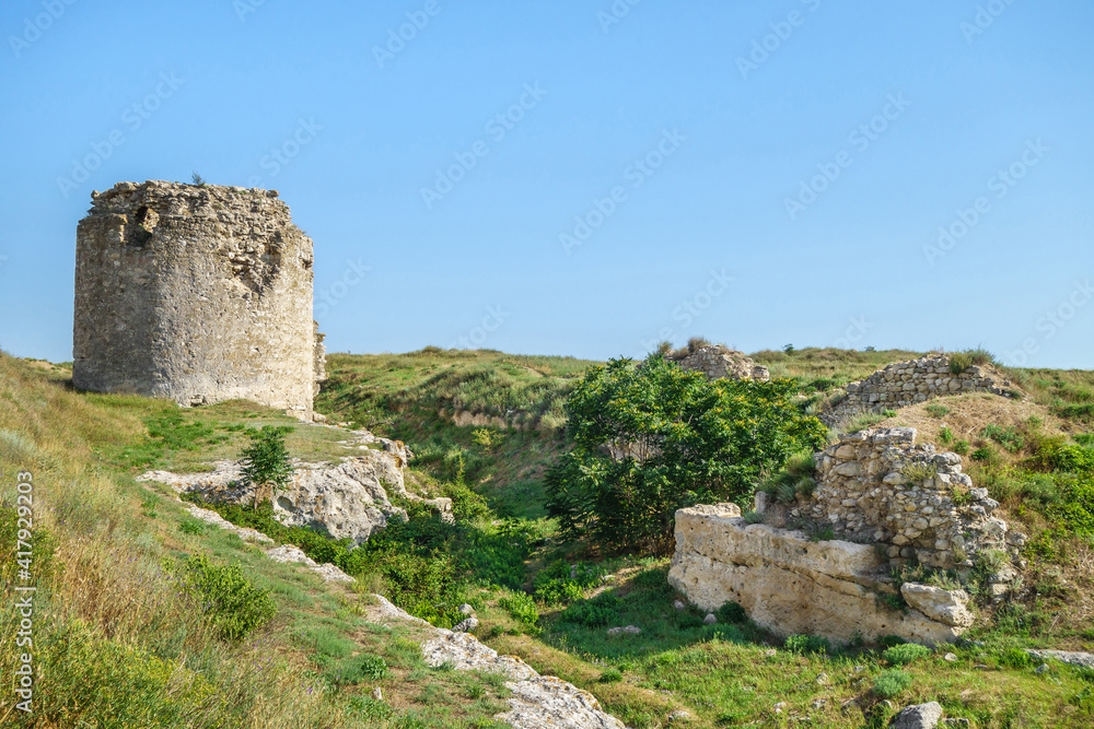 Tower and walls of medieval fortress Kalamita, Inkerman, Crimea. It was founded by Byzantines on top of rock with cave church that later became Inkerman Monastery of St Clement (still exist)