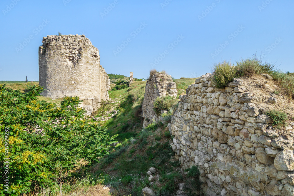 Line of defensive walls and tower of medieval fortress Kalamita, Inkerman, Crimea. Stronghold was founded by Byzantines in near cave church, that later became Inkerman Cave Monastery of St Clement