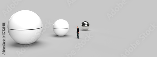 Fototapeta Naklejka Na Ścianę i Meble -  A lonely man in the middle of a big room with three giant spheres. 3d render