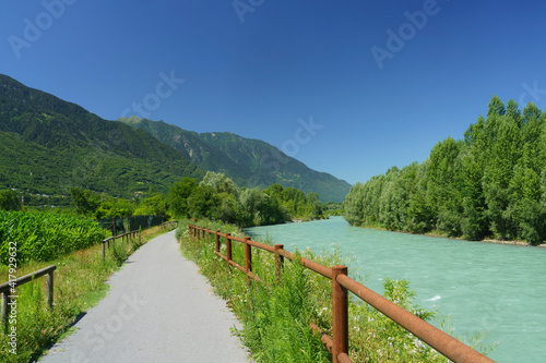 Fototapeta Naklejka Na Ścianę i Meble -  The Adda river along the Sentiero della Valtellina at summer