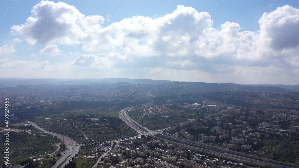 Jerusalem and Betlehem city wide aerial flight view
Drone high altitude view,clouds mountains, betlehem and Blue skies March 2021 Israel
